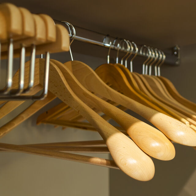 Solid beech wood hangers with their gently contoured shoulders care for your clothes just as thoughtfully as you would at home.