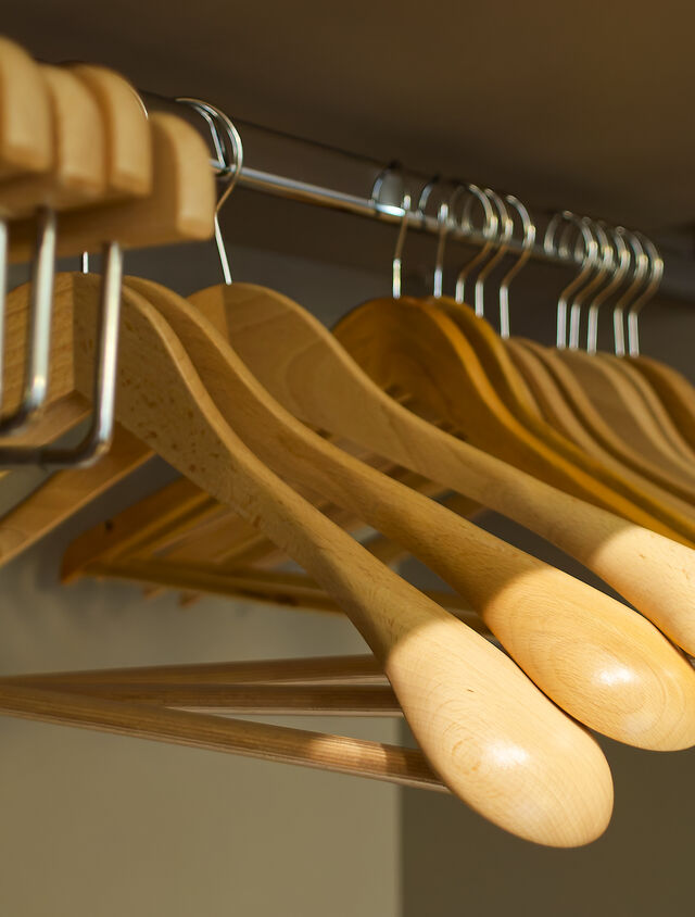 Solid beech wood hangers with their gently contoured shoulders care for your clothes just as thoughtfully as you would at home.